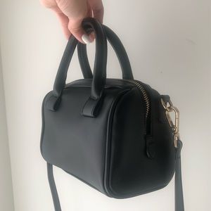 Black bowling bag with gold buckles